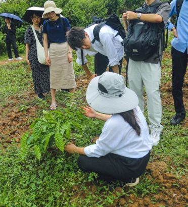 Students and researchers working together on sustainable farming practices to promote environmentally responsible agriculture.